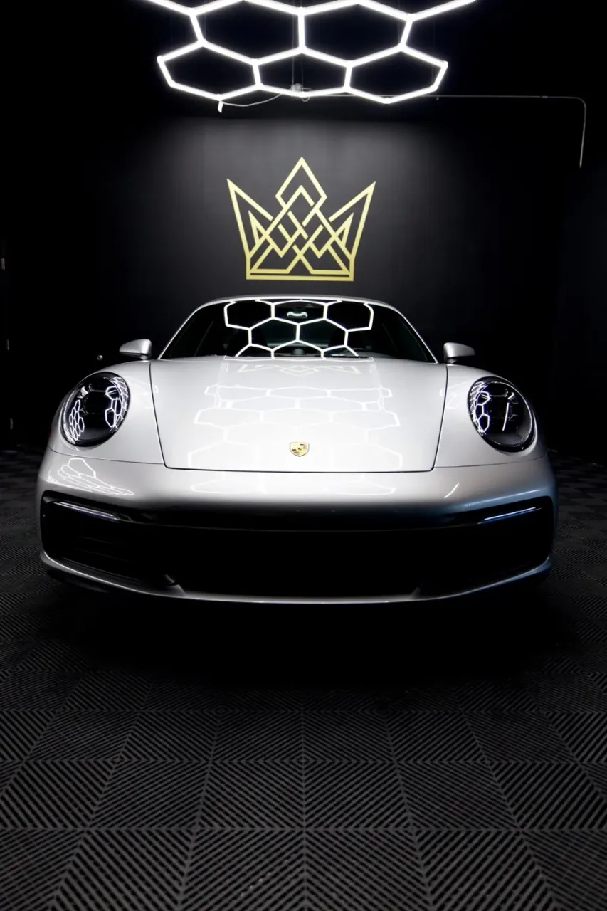 Silver Porsche 911 front in the Imperial Auto Lab studio