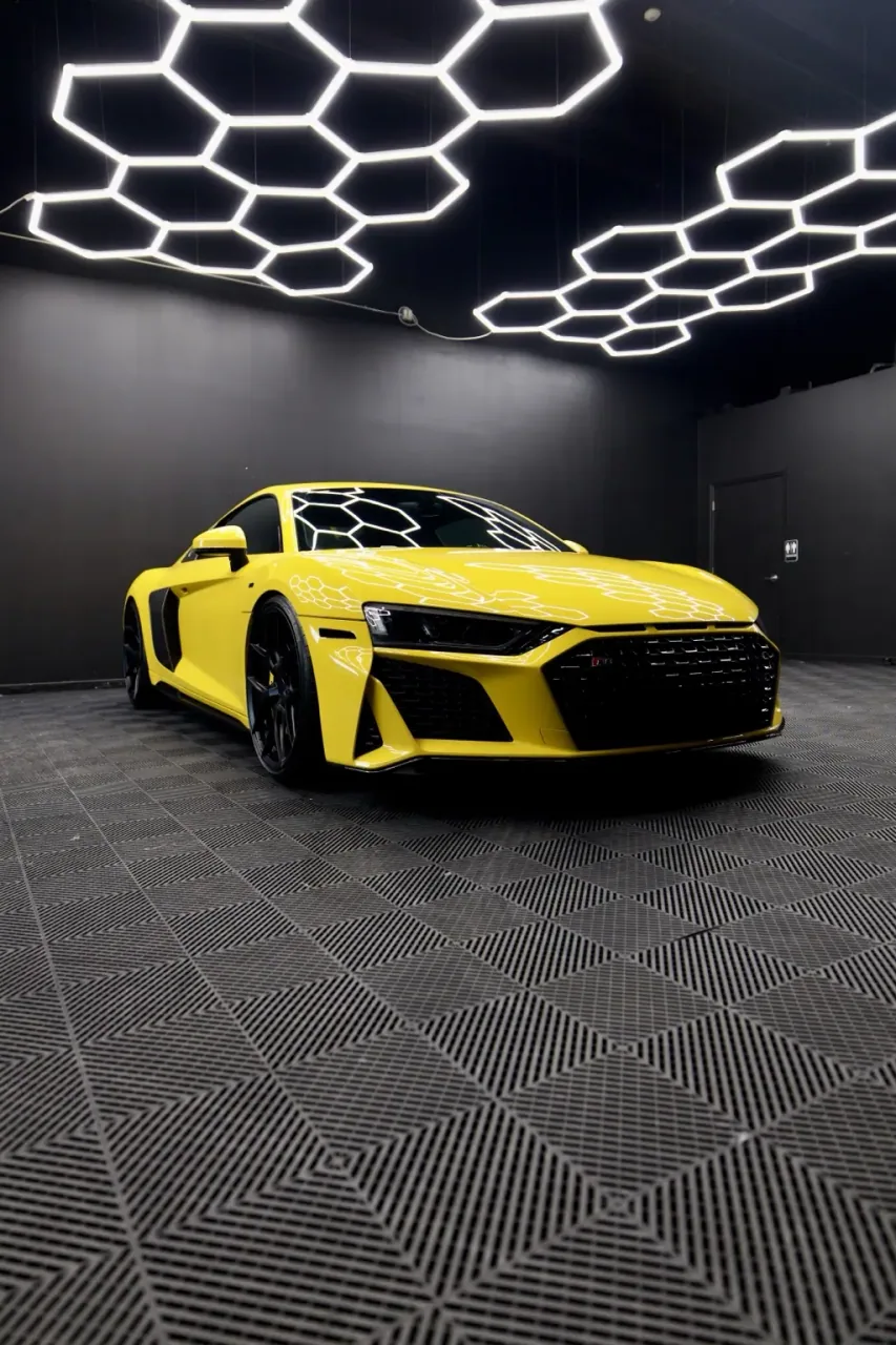 Yellow Audi R8 front in the Imperial Auto Lab studio
